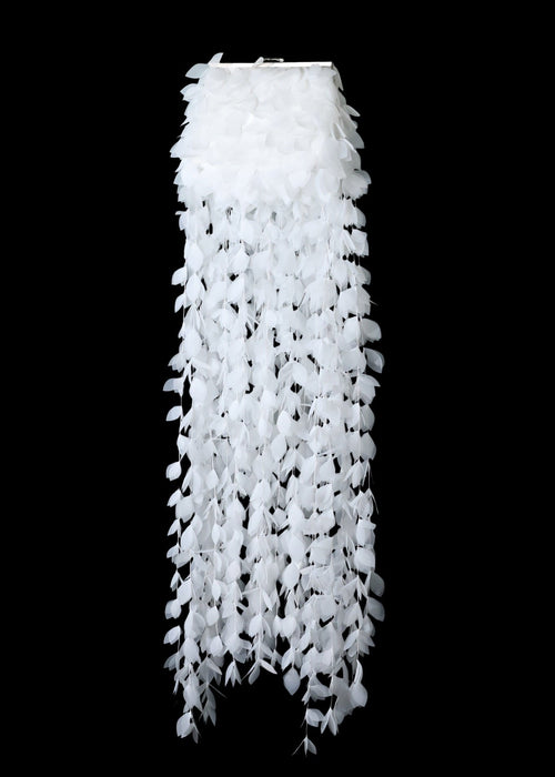 White lace curtain against a black background
