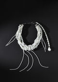 Pearl hair accessory on a black background