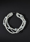 Pearl necklace on a black background
