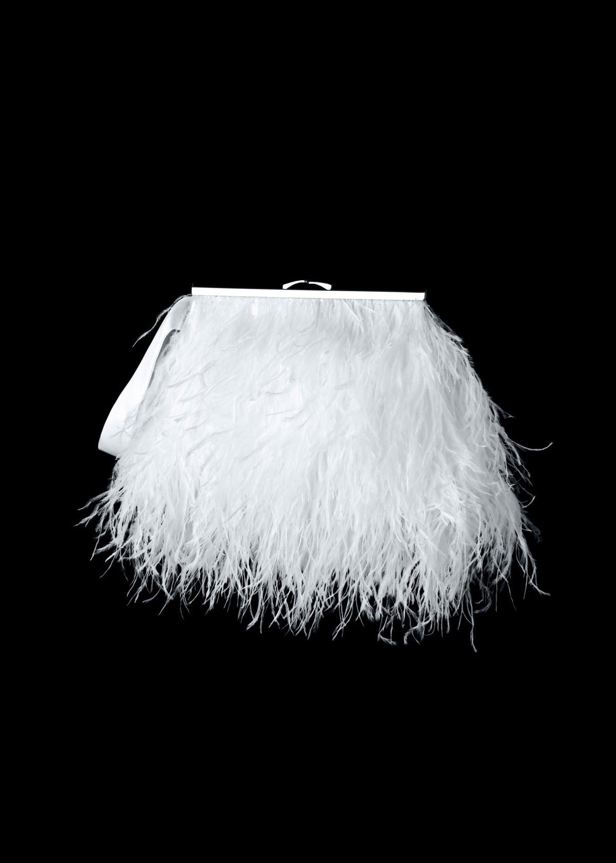 White feathered clutch bag on a black background