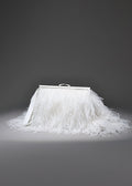 White feathered skirt with a silver frame on a gray background