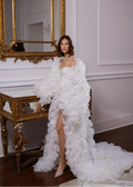 Woman in a white floral gown by Linni Caro