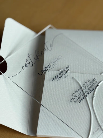 Folded white certificate with black text