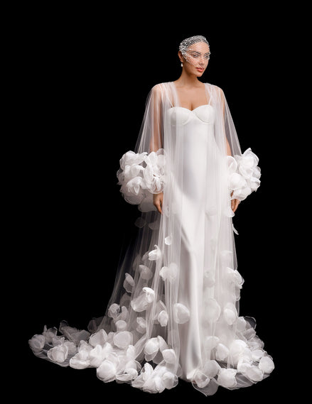 White wedding dress with floral details on a black background